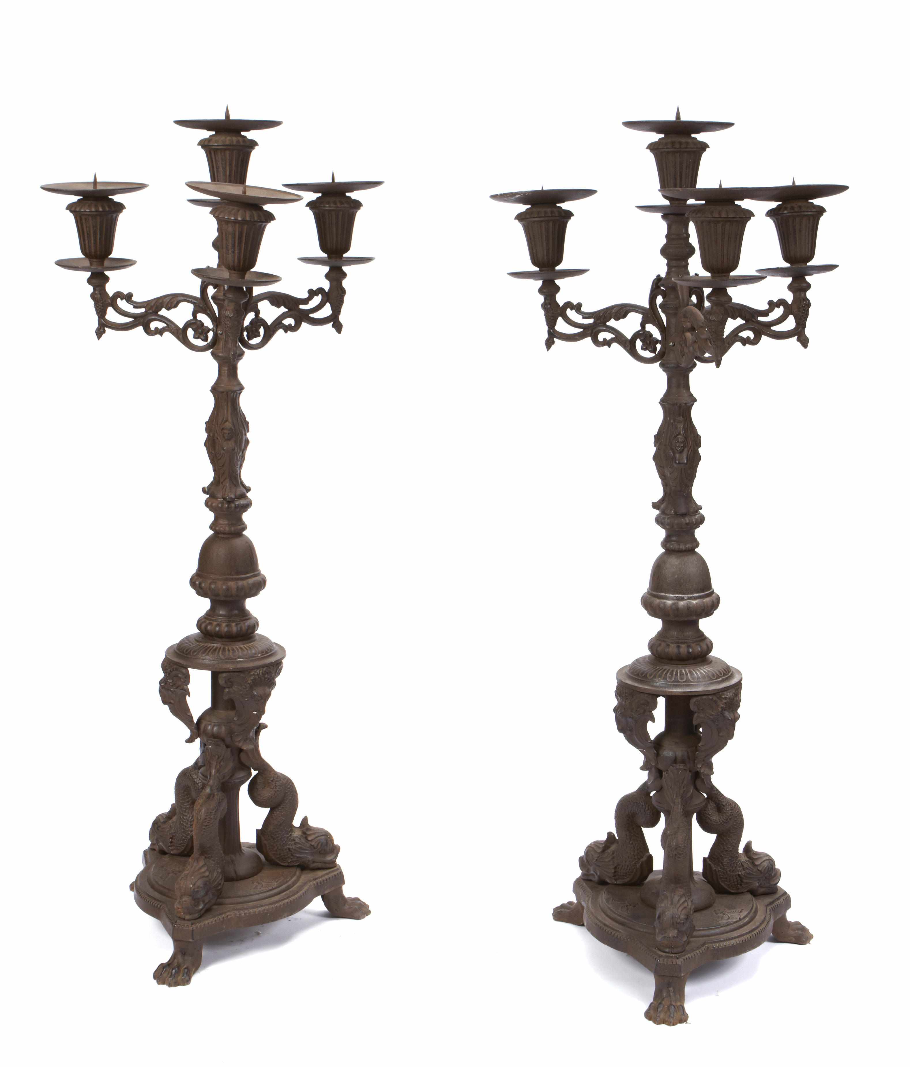 Appraisal: A pair of Rococo style cast iron four light torchieres