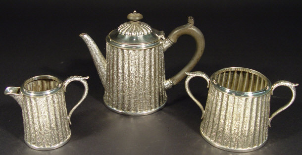 Appraisal: Three piece silver plated tea set of fluted form with