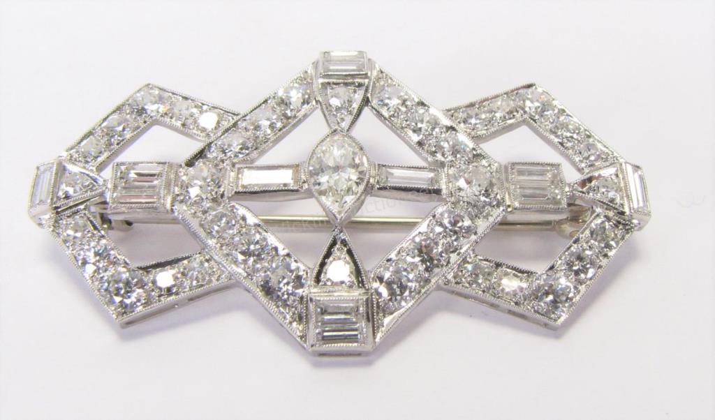 Appraisal: An K white gold art deco brooch holding marquise baguette