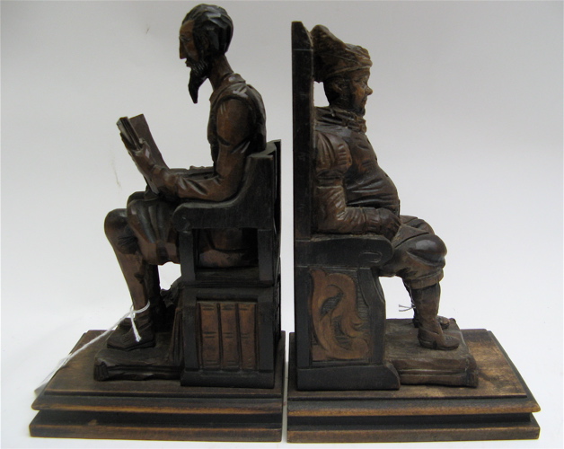 Appraisal: PAIR SPANISH HAND CARVED WOODEN FIGURAL BOOKENDS purchased in Madrid