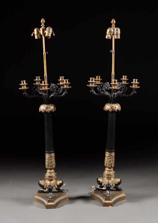 Appraisal: Pair of French Empire style ebonized and gilt-metal five-light candelabra