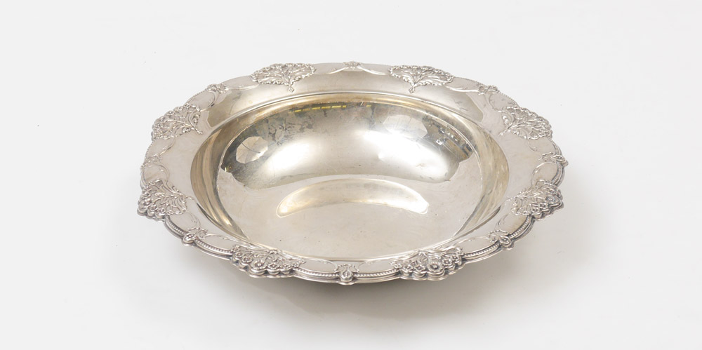 Appraisal: INTERNATIONAL SILVER STERLING SERVING BOWL Repousse floral and garland rim