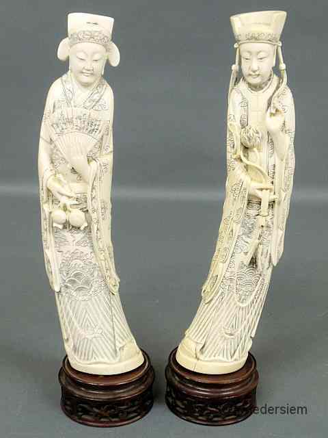 Appraisal: Finely carved pair of Asian ivory figures each dressed in