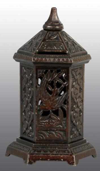 Appraisal: Cast Iron Space Heater with Bird Still Bank Description Manufactured