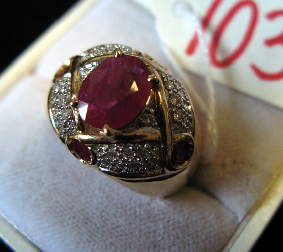 Appraisal: RUBY DIAMOND AND FOURTEEN KARAT GOLD RING centering an oval-cut