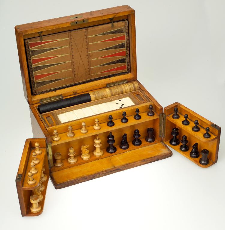 Appraisal: VICTORIAN PINE-CASED GAMES COMPENDIUM of rectangular form the hinged top