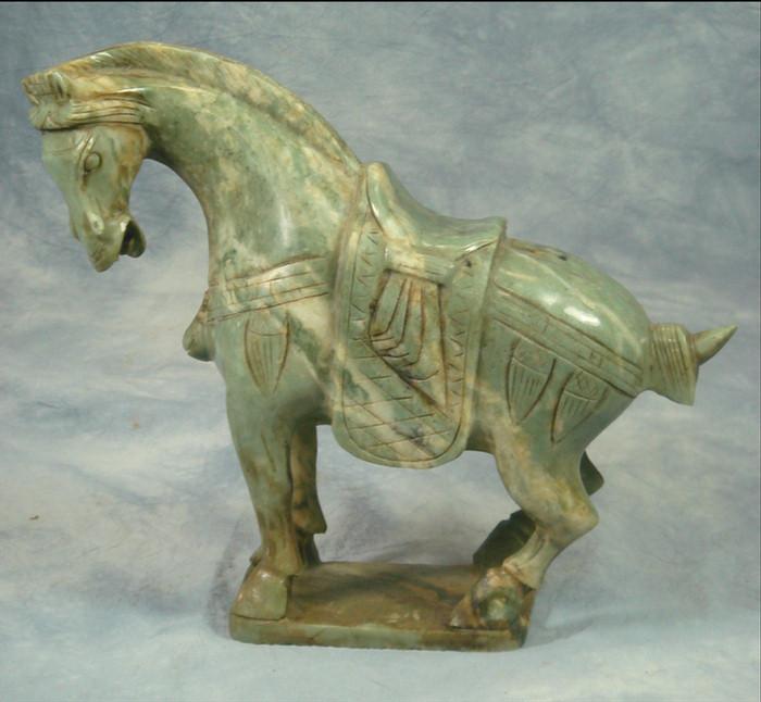 Appraisal: Carved green stone Chinese horse h l Estimate -