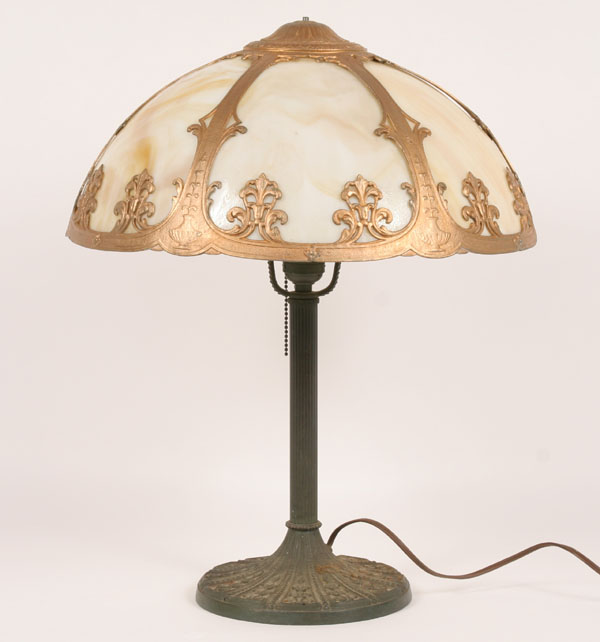 Appraisal: Cast caramel slag glass lamp with floral design on base