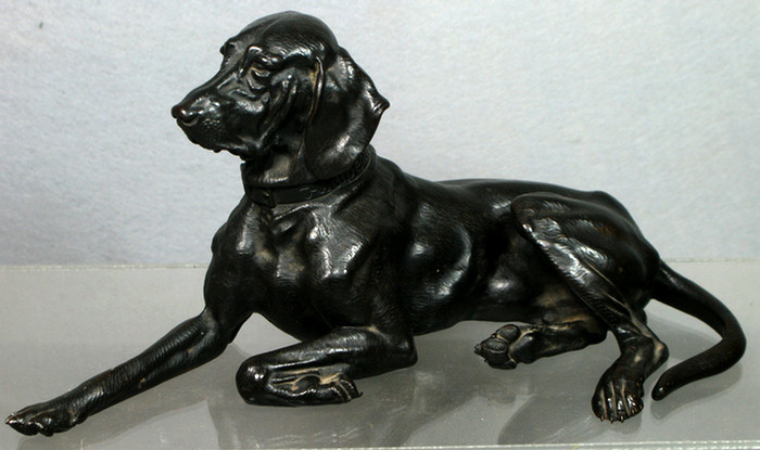 Appraisal: Patinated metal sculture of reclining dog signed on collar and