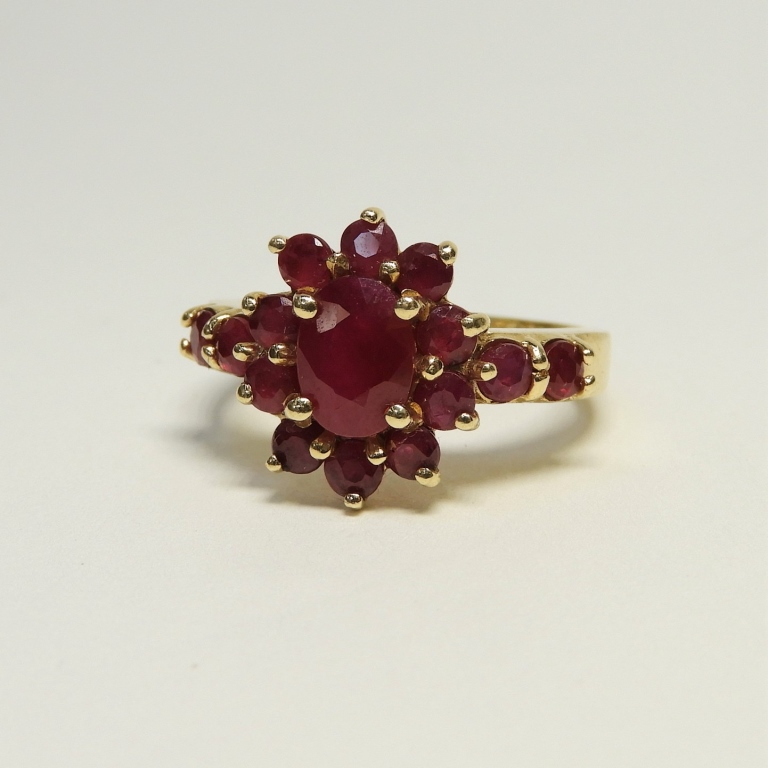 Appraisal: K GOLD RUBY CLUSTER FLOWER LADY'S RING th CenturyCenter oval