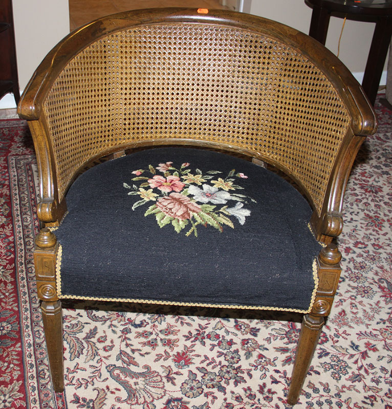 Appraisal: Fruitwood and caned tub chair needlepoint upholstered