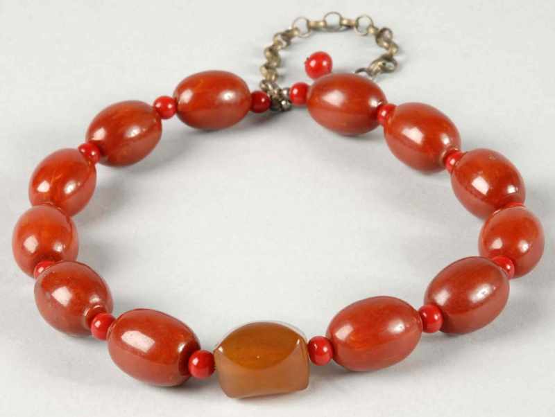 Appraisal: Bakelite Beaded Necklace Description Cherry colored beads with amber colored