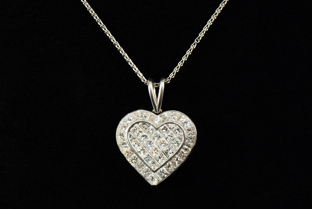 Appraisal: PLATINUM CTW DIAMOND HEART PENDANT NECKLACE square brilliant and trapeze