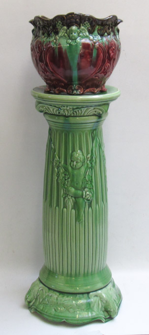 Appraisal: POTTERY JARDINIERE WITH PEDESTAL the jardiniere glazed in a burgundy