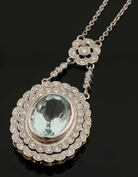 Appraisal: An aquamarine and diamond pendant The oval pendant centrally set