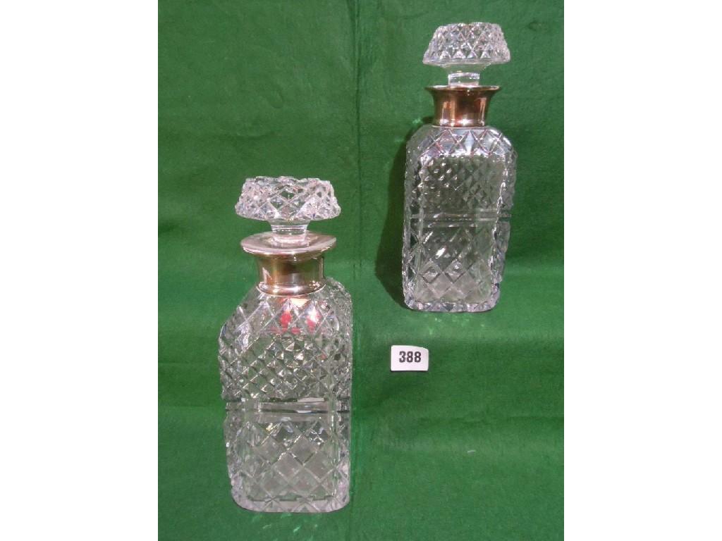 Appraisal: A good pair of square cut glass decanters with silver