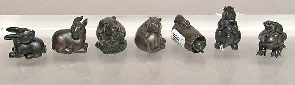 Appraisal: A group of seven small Japanese-style wood carvings Each with