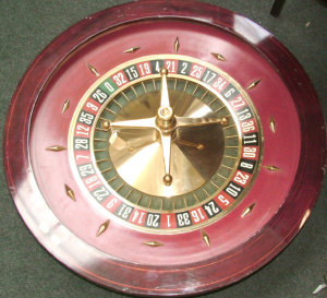 Appraisal: A th century bronze mounted casino roulette wheel with crossbanded