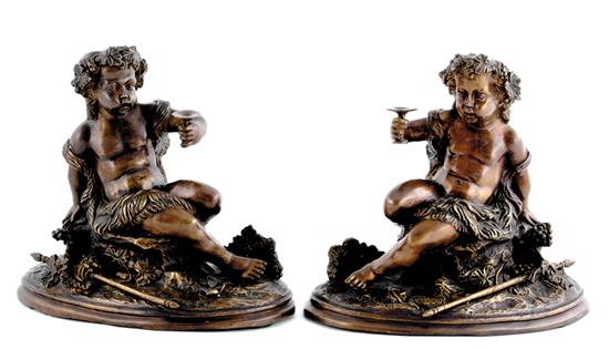 Appraisal: Continental school th century PAIR RECLINING PUTTI bronze H W