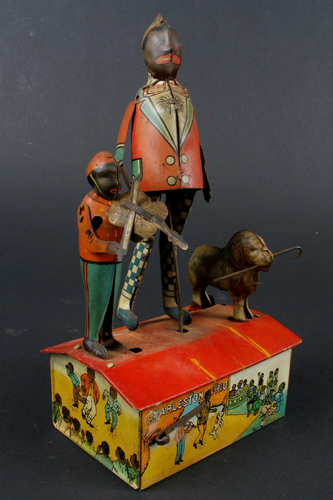 Appraisal: A CHARLESTON TRIO DANCING TIN TOY FIGURE by Marx c