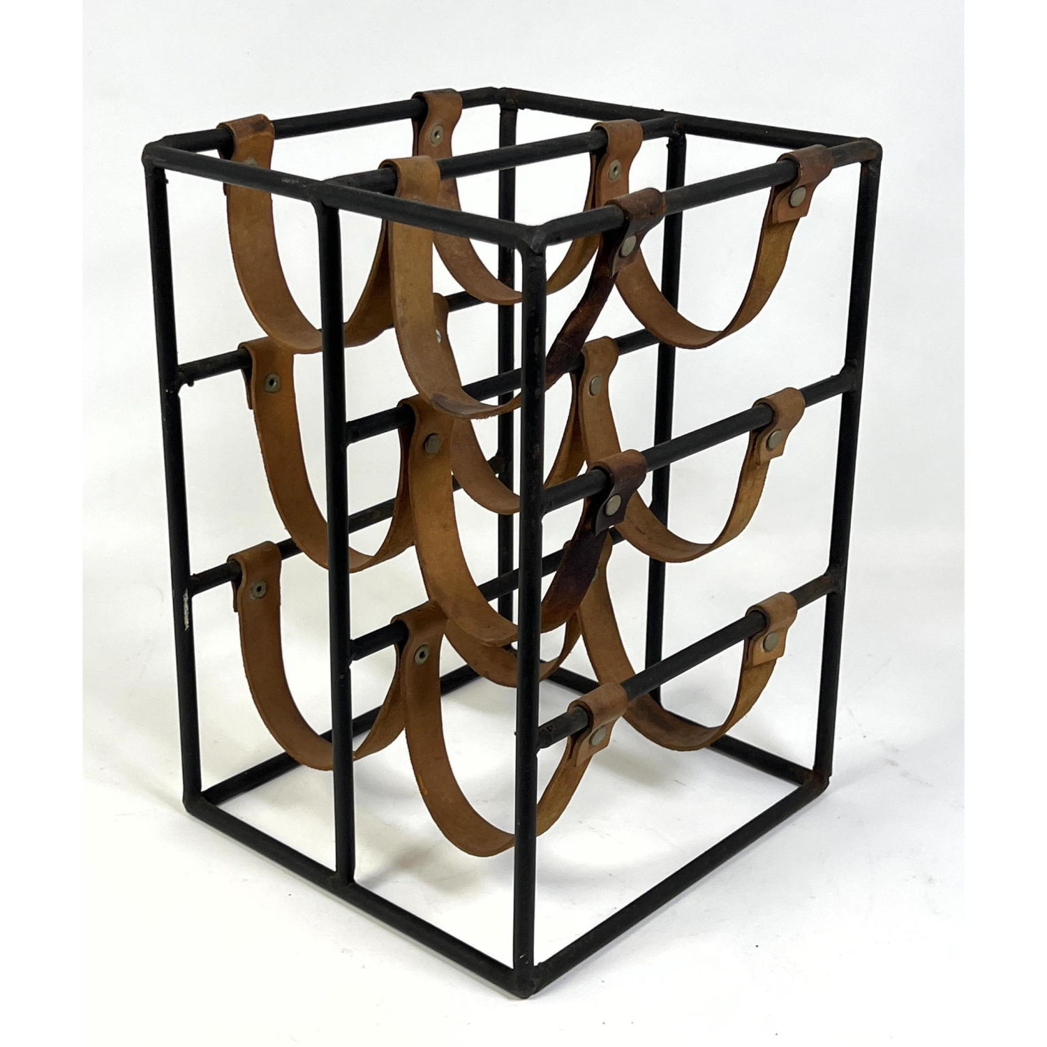 Appraisal: ARTHUR UMANOFF Black Iron and Leather Wine Rack Dimensions H