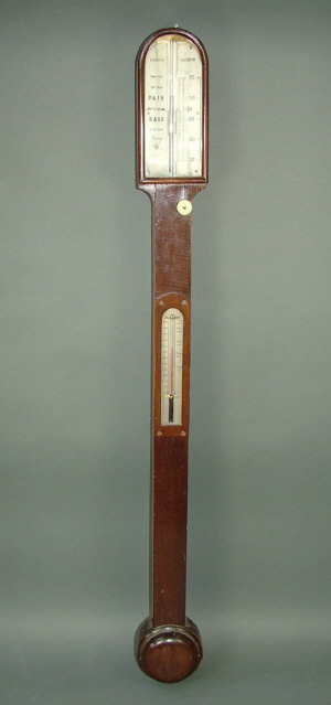 Appraisal: A th century mahogany cased stick barometer with thermometer and