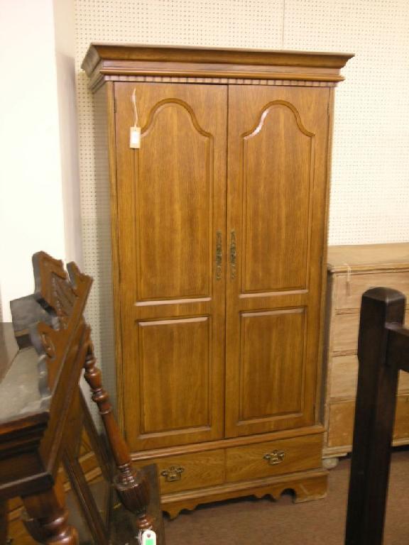 Appraisal: A modern oak veneered wardrobe pair of three-quarter length arched