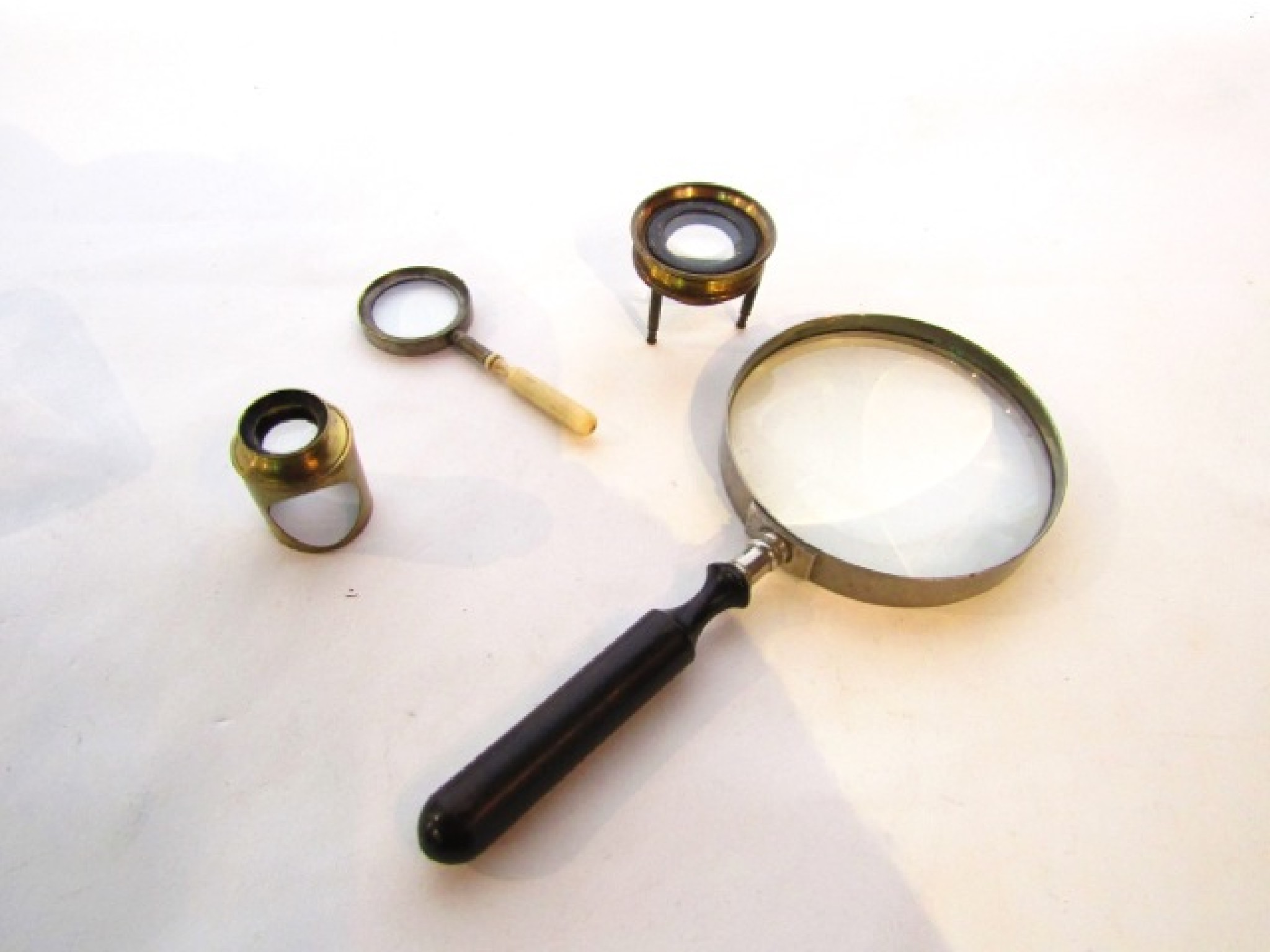 Appraisal: A magnifying lens with turned ebony handle another pocket type