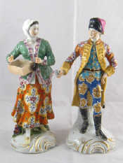 Appraisal: A pair of ceramic figures the gentleman wearing a fur