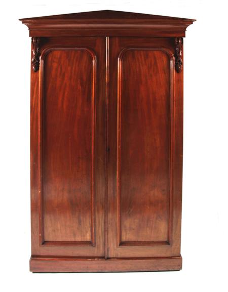 Appraisal: A Victorian mahogany wardrobe the projected moulded cornice over two