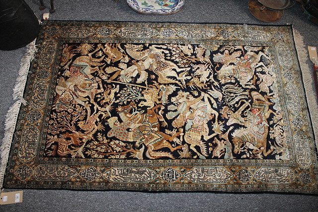 Appraisal: A PERSIAN SILK RUG with central panel with hunting scenes