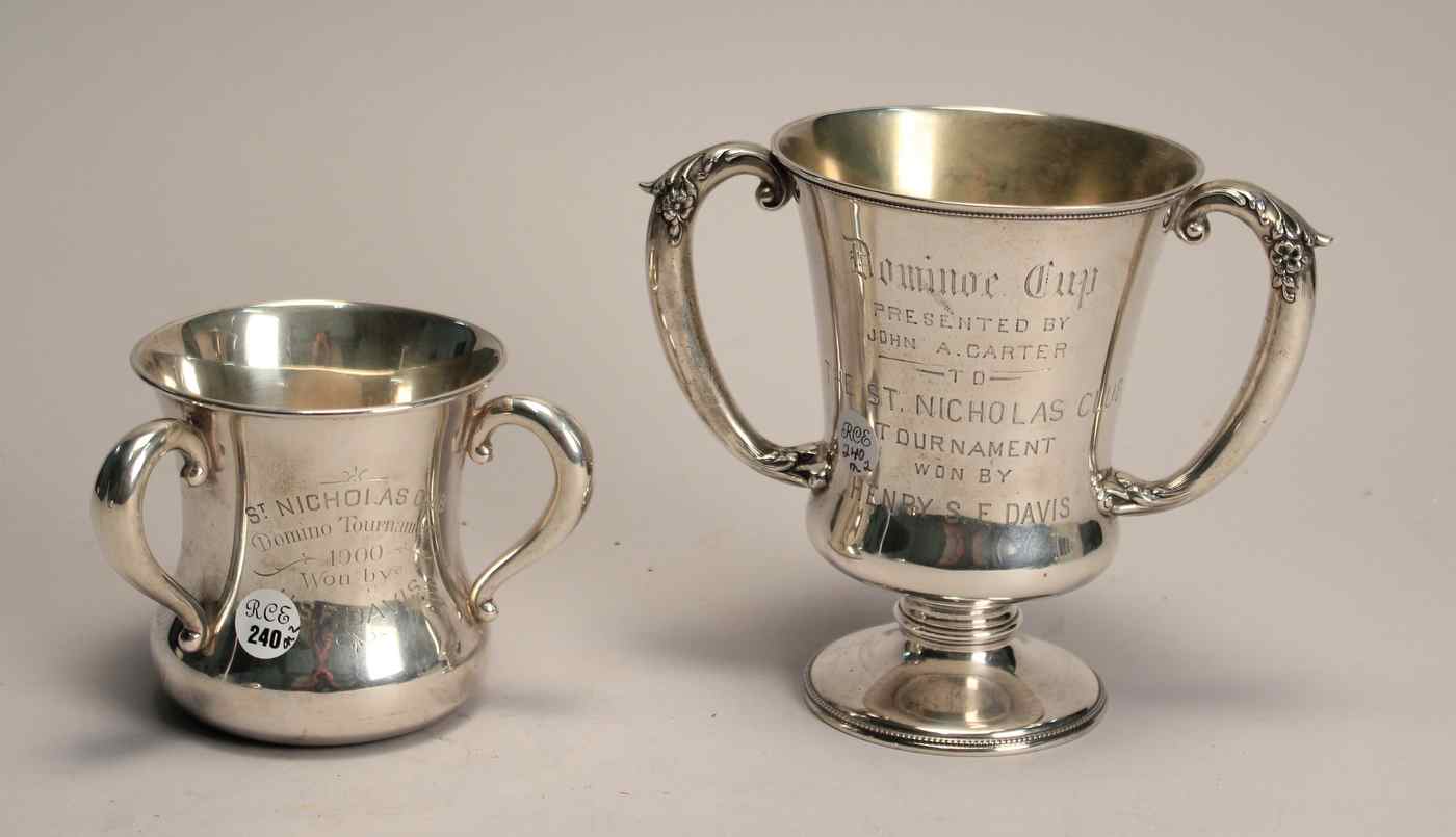 Appraisal: TWO STERLING SILVER TROPHY CUPSA three-handled cup by Theodore B