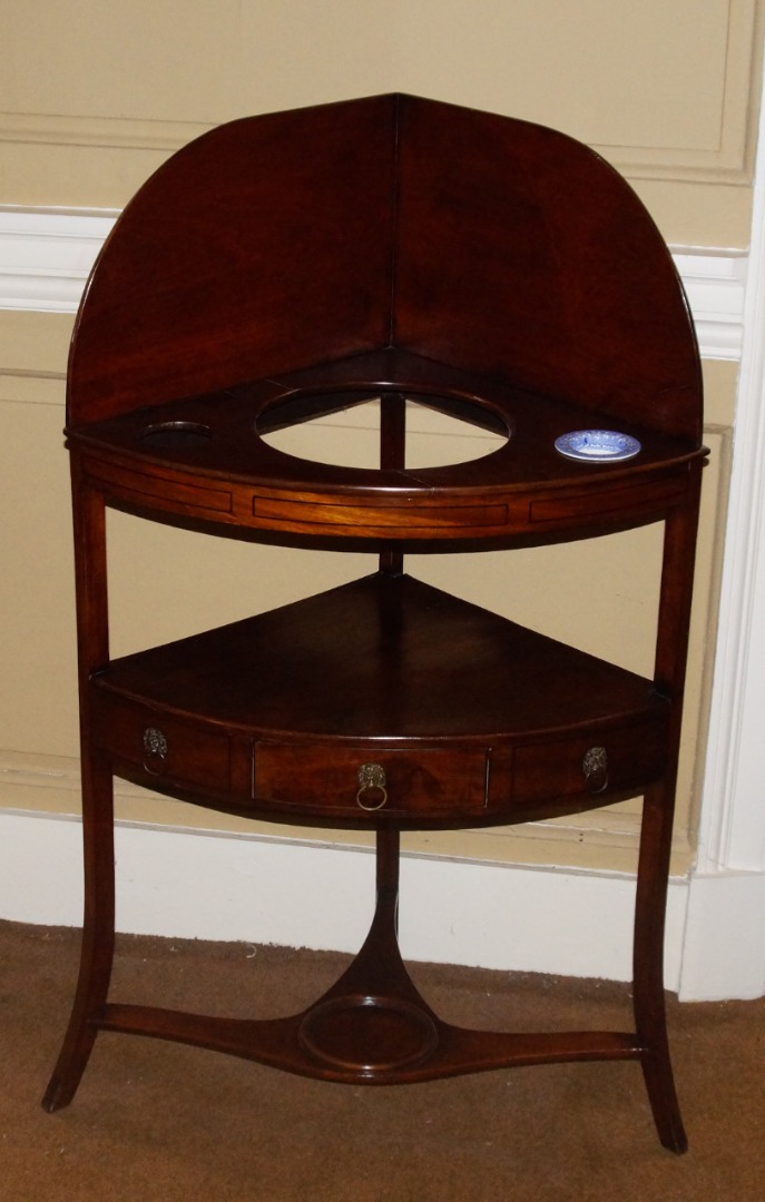 Appraisal: An early thC mahogany and ebony strung corner washstand with