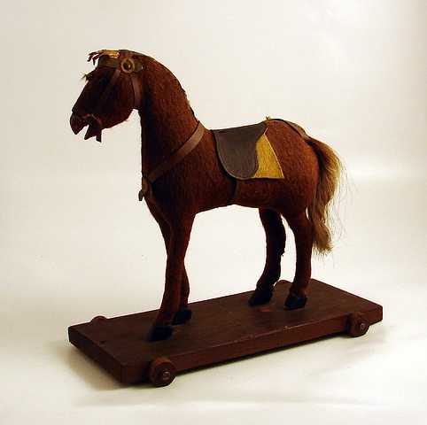 Appraisal: Standing figure with saddle and harness t l Ship plus