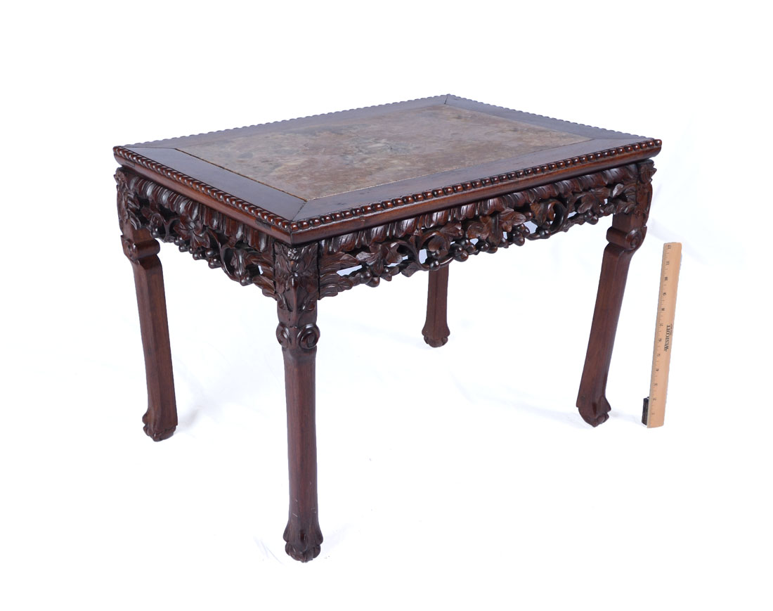 Appraisal: CARVED ORIENTAL MARBLE TOP COFFEE TABLE Inset variegated marble top