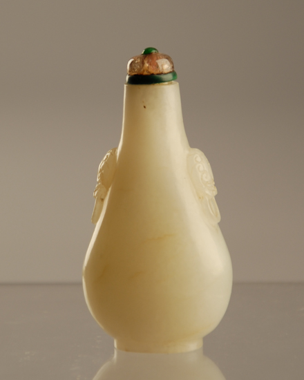 Appraisal: A th C White Jade Snuff Bottle with a darker