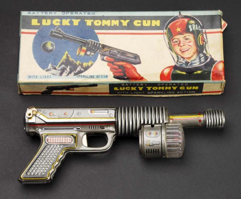 Appraisal: Lucky Tommy Gun Battery-Operated Toy Description Japanese Made by SH