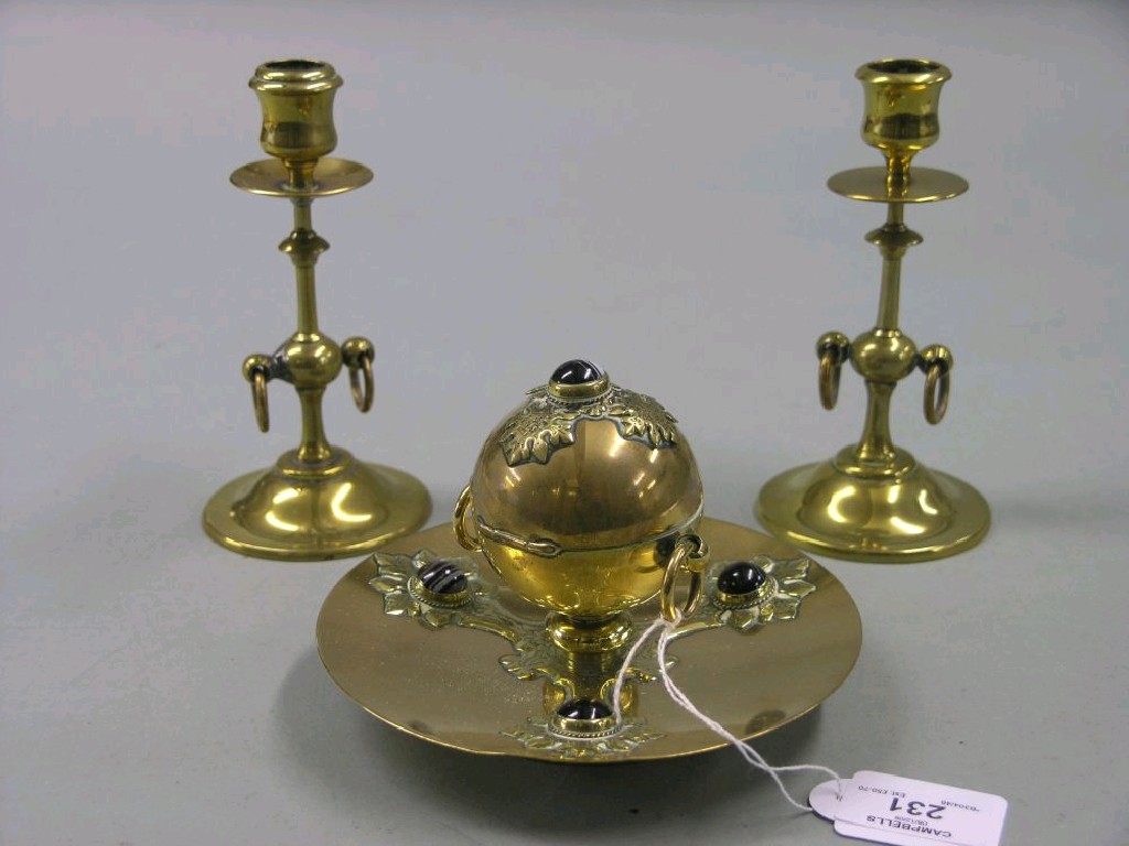 Appraisal: A late Victorian brass desk garniture consisting of circular inkwell