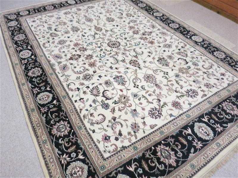 Appraisal: HAND KNOTTED ORIENTAL CARPET Indo-Persian overall floral Isfahan design on