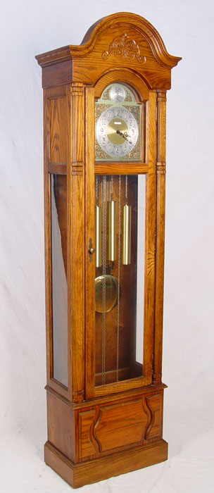 Appraisal: HOWARD MILLER OAK CASE GRANDFATHER CLOCK Model - weight driven