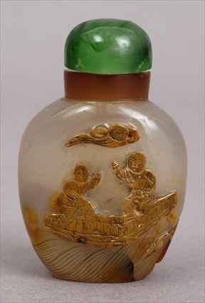 Appraisal: CHINESE CARVED AGATE SNUFF BOTTLE AND STOPPER Relief-carved with figures