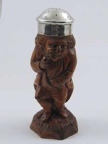 Appraisal: A carved wooden pepper pot with silver lid hallmarked B'ham