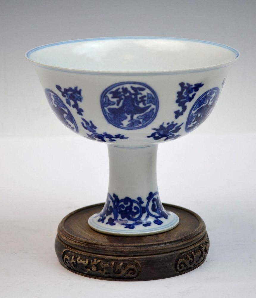 Appraisal: CHINESE BLUE WHITE PORCELAIN FLORAL FOOTED CUP Chinese blue and