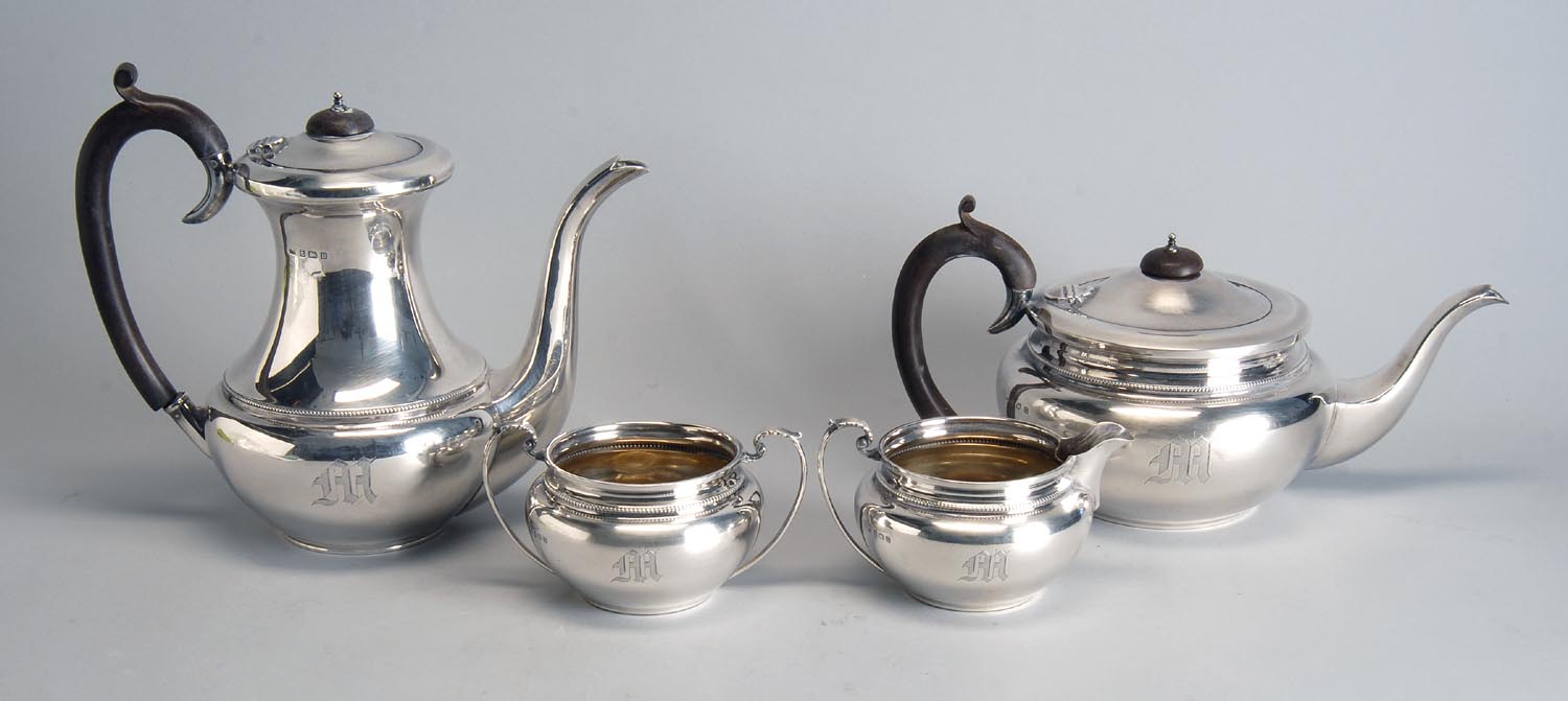 Appraisal: FOUR-PIECE ENGLISH SILVER TEA SET Birmingham In squat round form