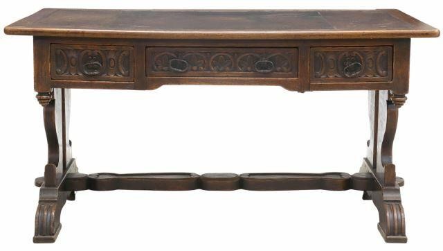 Appraisal: Spanish Renaissance Revival oak writing desk th c rectangular top