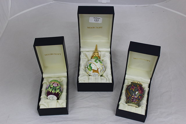 Appraisal: THREE MINIATURE MOORCROFT ENAMEL VASES in original presentation boxes