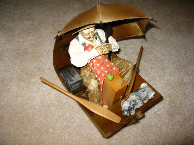 Appraisal: Gone Fishing Norman Rockwell Figurine by Clothtique a man and