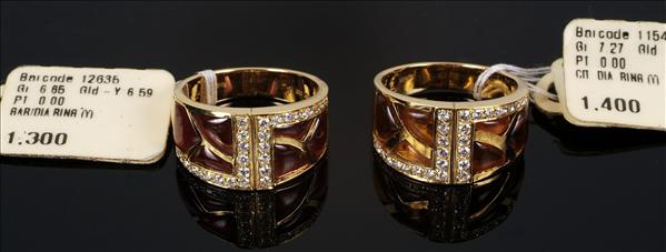 Appraisal: A pair of gem set and diamond rings set with