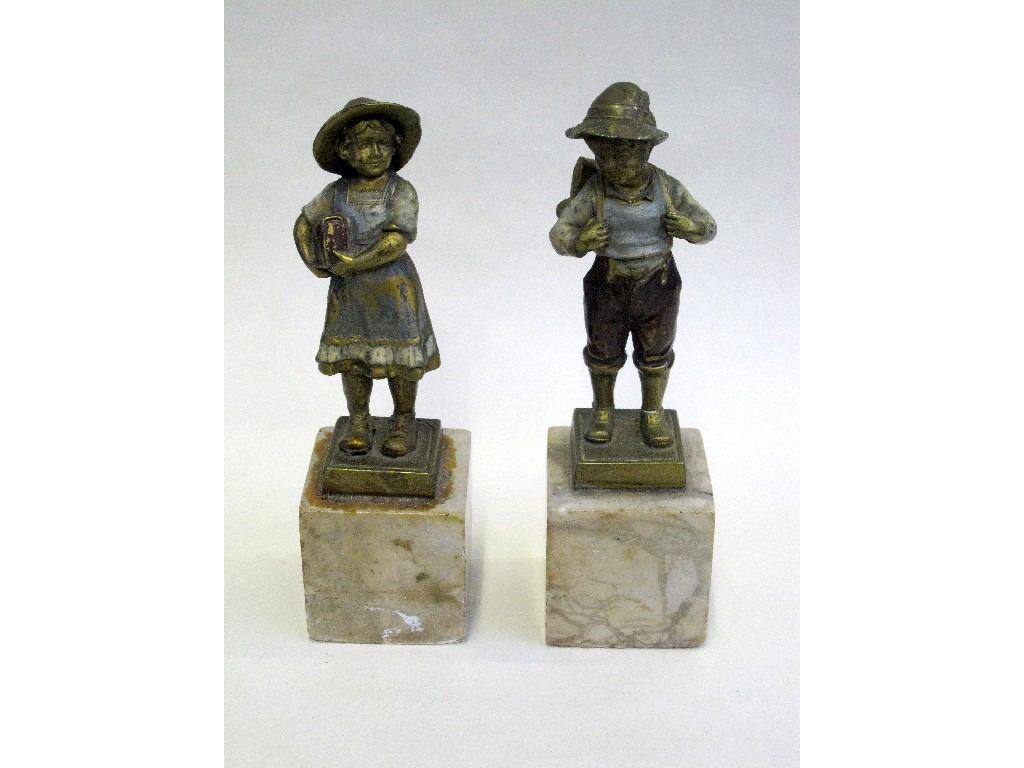 Appraisal: Pair of painted bronze figures of schoolchildren on marble bases