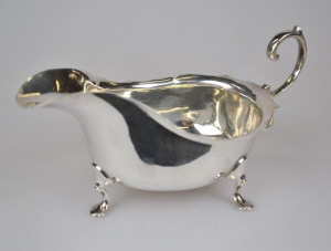 Appraisal: A Georgian style silver sauce boat with cut rim and